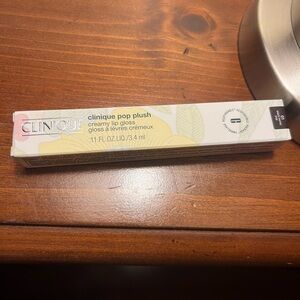 Cinique lip gloss black honey.  Never opened